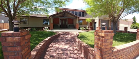 Front yard with grass and SHADE from the trees.  Very nice in the summer.