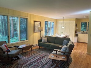 Long view of living room with dining & kitchen at far end