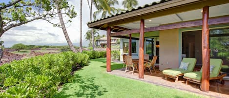 Expansive lanai and grass area.