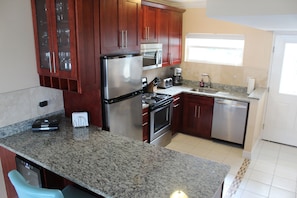 Just renovated!  Kitchen with granite counters and all stainless applicances