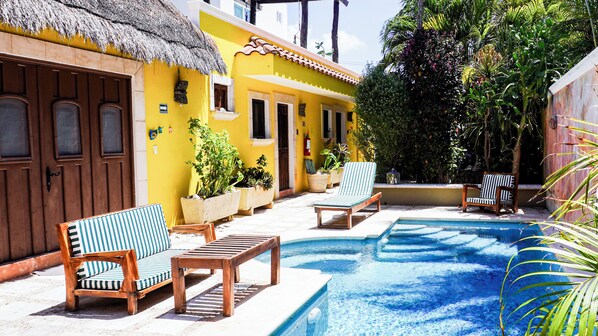 The suite opens to the pool/garden.