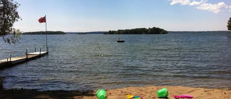 Sandy Beach with Wade-in Shoreline and Floating Dock.