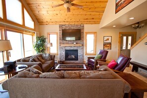 Great room with satellite TV and brick fireplace for cool evenings
