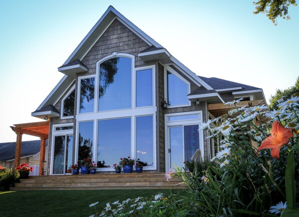 Front of home.  Living room overlooking lake.