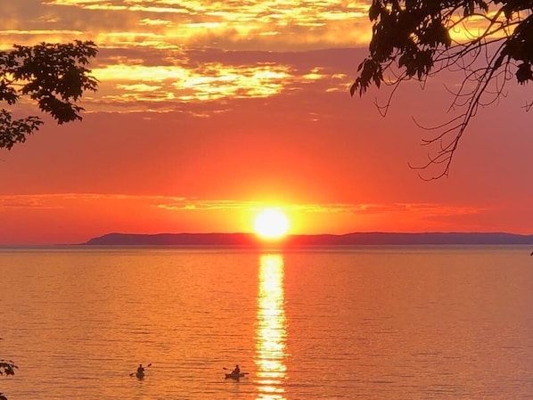 Sunset views over the Manitou Islands, the Lighthouse and Pyramid Point