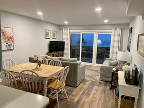 Family Room with new sliders and access to trex deck with high top chairs (4)