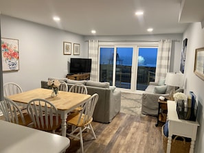 Family Room with new sliders and access to trex deck with high top chairs (4)