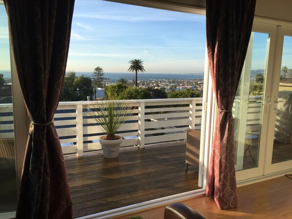 French doors open onto the deck.