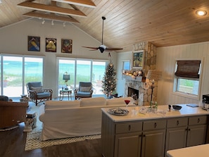 View from kitchen to great room and rear deck. Panoramic ocean views