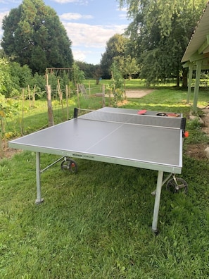 Ready for a match? Ping-pong is next to the vegetable garden. 