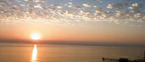 Incredible sunrise over the ocean from the balcony looking towards pier