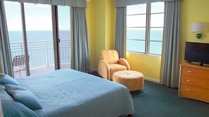 Guest bedroom with two full beds and oceanfront views. 
