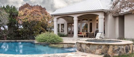 The crystal-clear waters of your own private pool and hot tub add cooling and pampering touches on a hot Texas day.