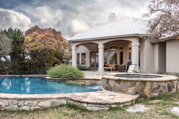 The crystal-clear waters of your own private pool and hot tub add cooling and pampering touches on a hot Texas day.