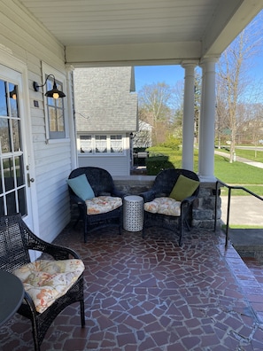 The front porch is the perfect place to enjoy a cool beverage.