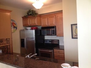 Kitchen looking over granite bar.