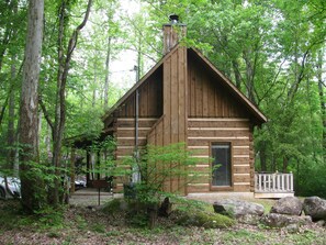 Side view, coming soon is a huge back deck that will put you right on the creek.