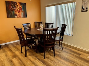 Dining table 6 chairs, 4 bar stools at Island. with new flooring