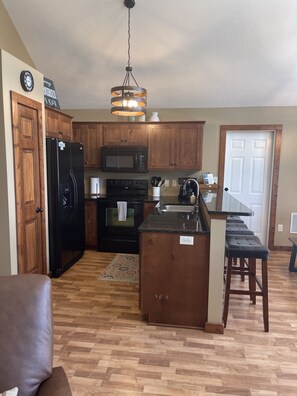 Fully equipped kitchen with full size appliances including dishwasher. 