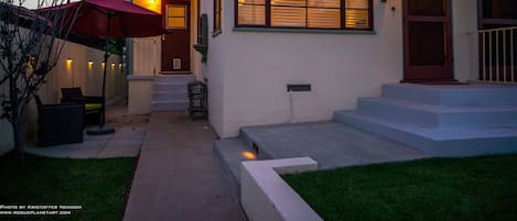 Outdoor patio (at left) at dusk.