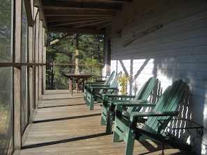 Screened in porch, great for relaxing and outdoor dining