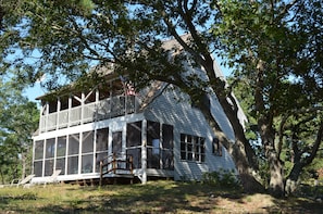Two levels of porches face west toward the sunsets