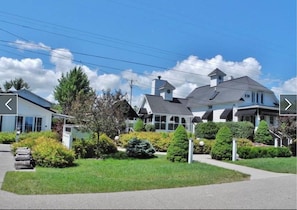 White Fence of Suttons Bay- Carriage House-Suites pictured on the left