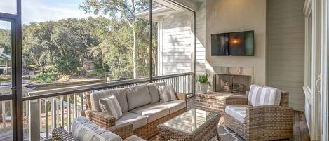 Off Living Room and Dining Area is a Beautiful Screened Porch Overlooking Pool and Lagoon at 24 Rum Row