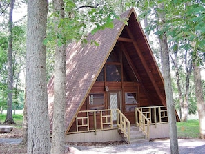 Our redwood a-frame chalet with a private deck overlooking the pond.