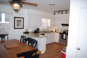 Fully equipped kitchen with full size washer and dryer.