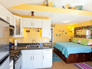 Kitchen view ..stainless steel fridge, microwave and stove