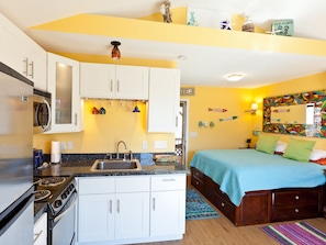 Kitchen view ..stainless steel fridge, microwave and stove