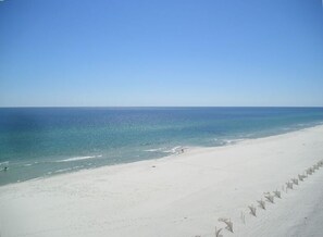 View of beach from balcony looking West