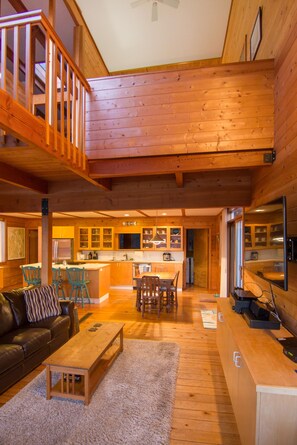 Living room with kitchen in back and master upstairs
