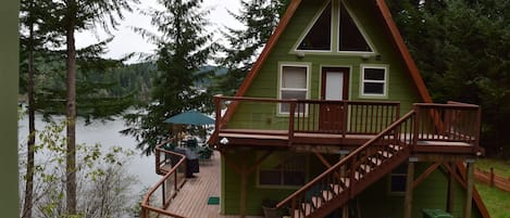 View from the pump house. Entrance is on left by patio umbrellas.