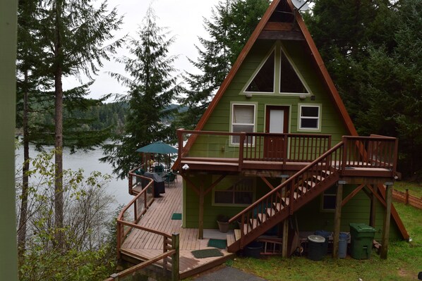 View from the pump house. Entrance is on left by patio umbrellas. 