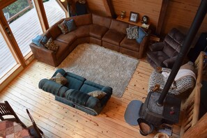 Main floor living room looking down from the loft