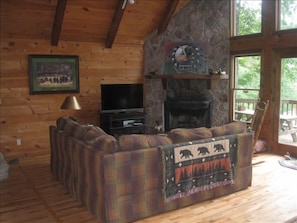 Flat screen TV with satellite and fireplace with plenty of wood stocked.