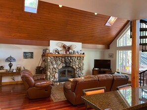 Living room with wood burning fireplace