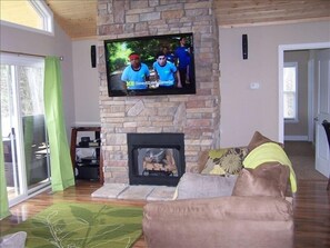 Main Level Great Room with Fireplace & 55'HDTV Lake View Walkout to Large Deck