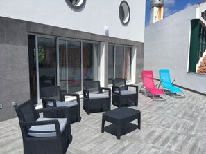 Terrace with sunbaths chairs with ocean view