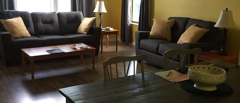 View into Dining/Living Area (50 inch TV is on wall to left)