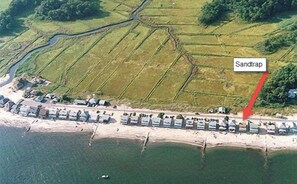 The Sandtrap is located at Hawks Nest Beach.