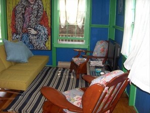 Living area with flat screen TV and futon couch