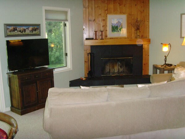 Our living area features a fireplace, original art, and a sofa bed.