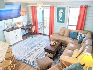comfortable seating and 65-in Smart TV perfect for family movie nights!