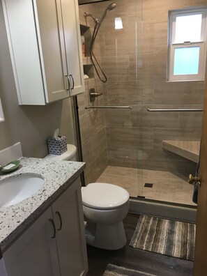 Remodeled bathroom with tiled walk in shower