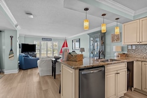 Open floor plan.
Kitchen leading to living room