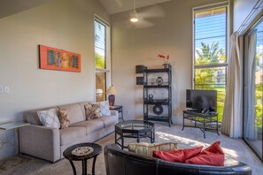 The living area features a cathedral ceiling and windows with views on 3 sides.