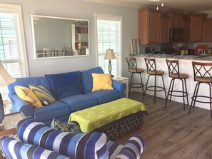 Main living area with pull out sofa bed, TV with cable